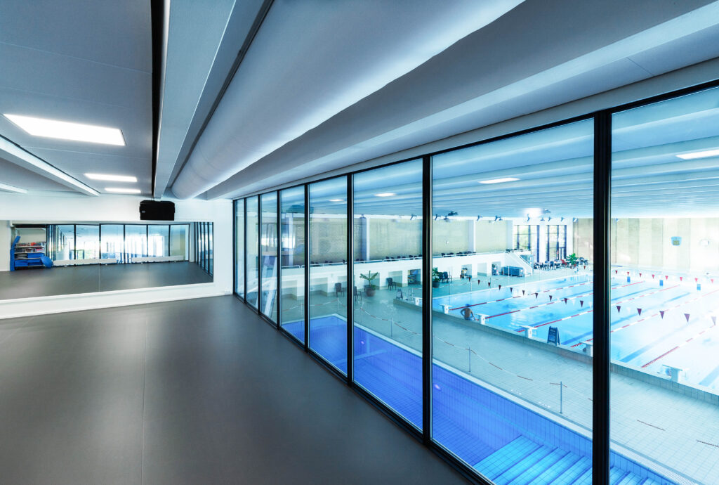 Swimming pool air duct system with white ventilation duct design in Vestbadet, Brøndbyvester, Denmark, 1