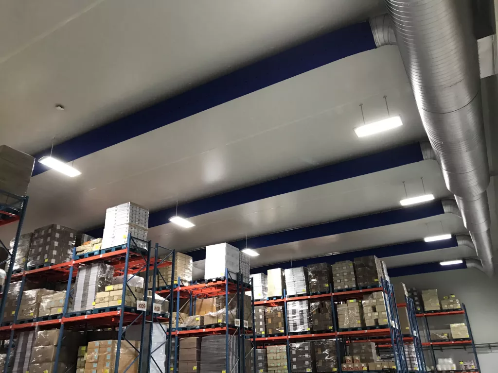 Blue fabric duct design in a factory, UK