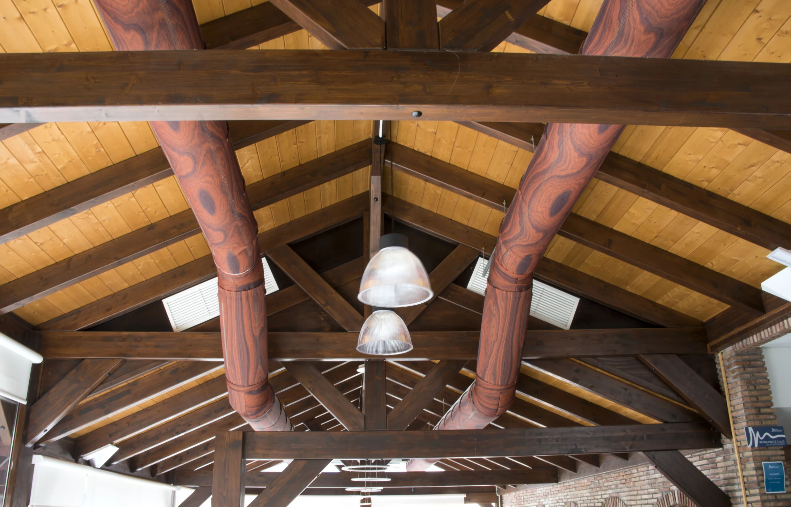 Two air duct systems with brown ventilation ducts in Hotel Las Calas, Spain