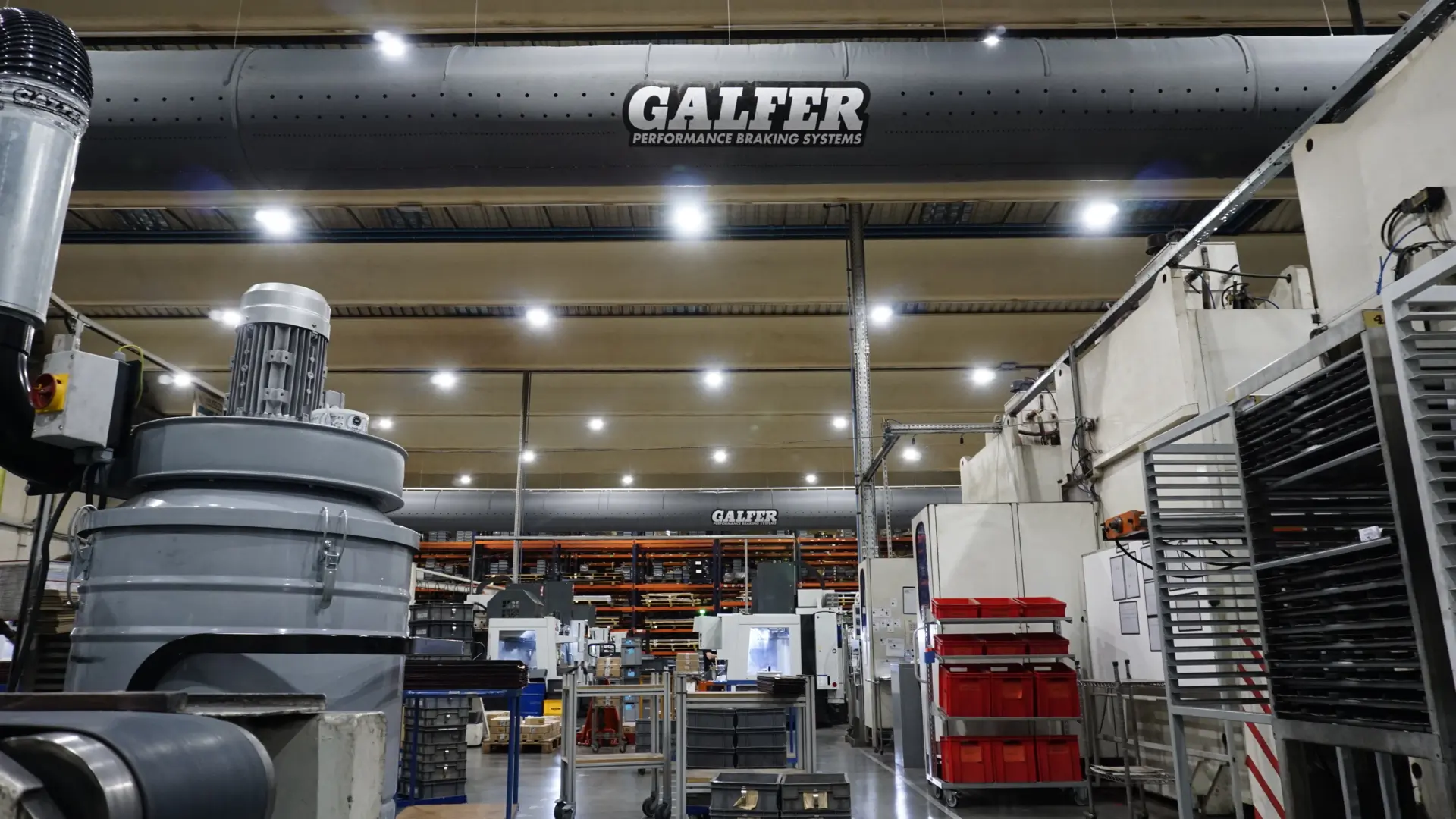 Grey air duct systems installed inside Galfer production factory, Spain