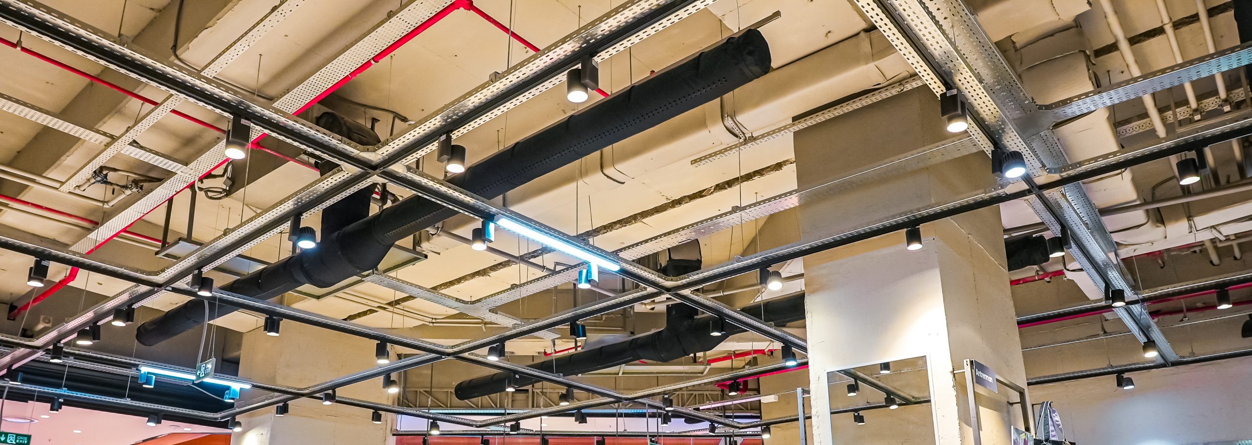 Black air duct systems inside an Adidas apparel store