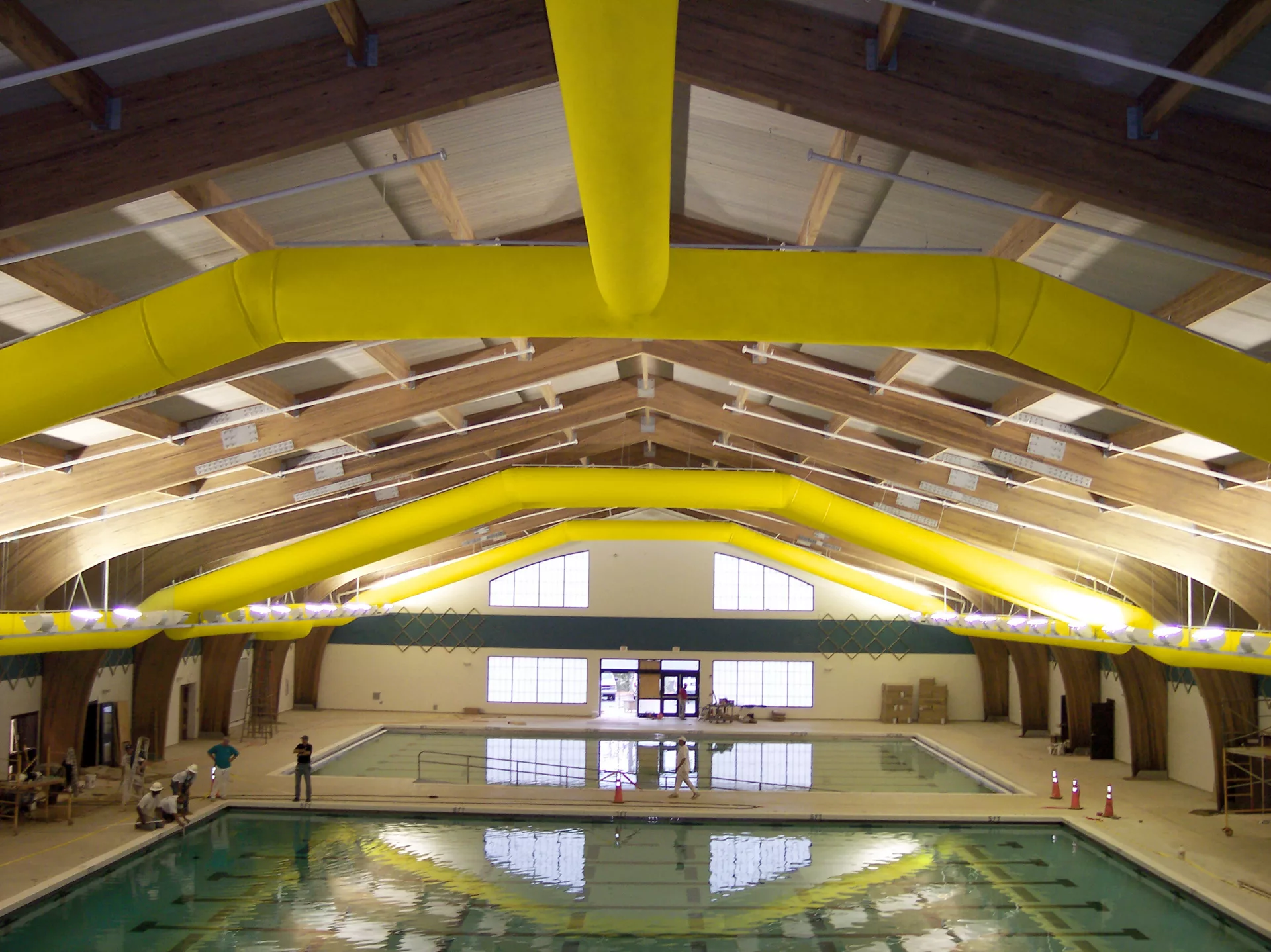 Yellow air ducts installed inside a swimming pool facility, US