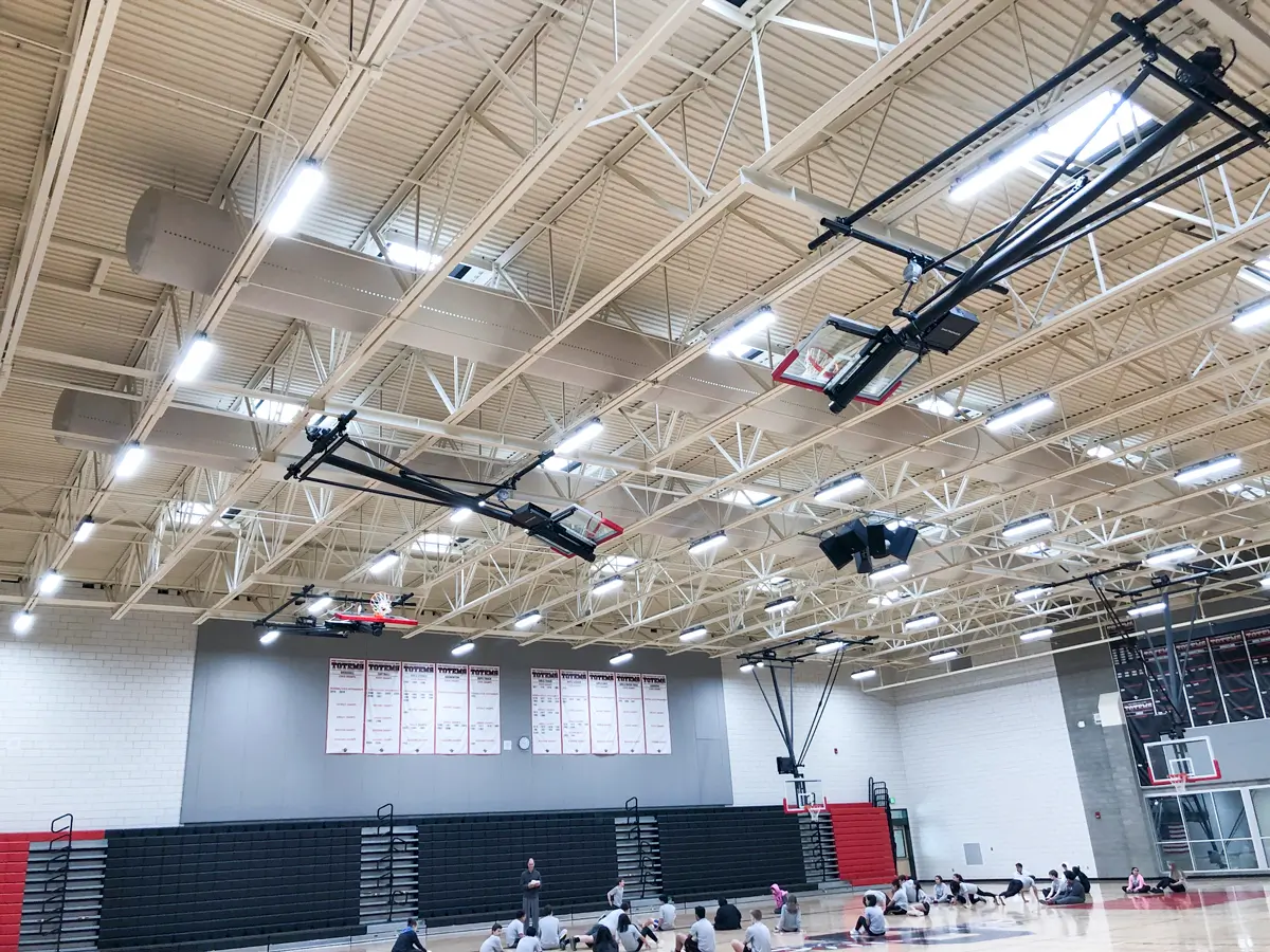 White air ducts installed in a school sports hall, Sammamish HS