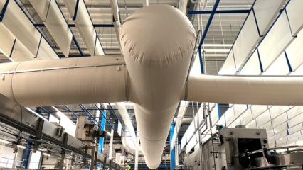 Custom-engineered fabric air dispersion systems installed in an mineral water bottling facility established in 1247