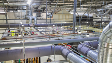 Gray fabric ducting installed in the open ceiling of the Spencer Outlet Centre in Melbourne, Australia
