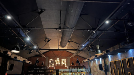 Black fabric ducting provides comfort and enhances the design of a Resto-bar in Thane, India