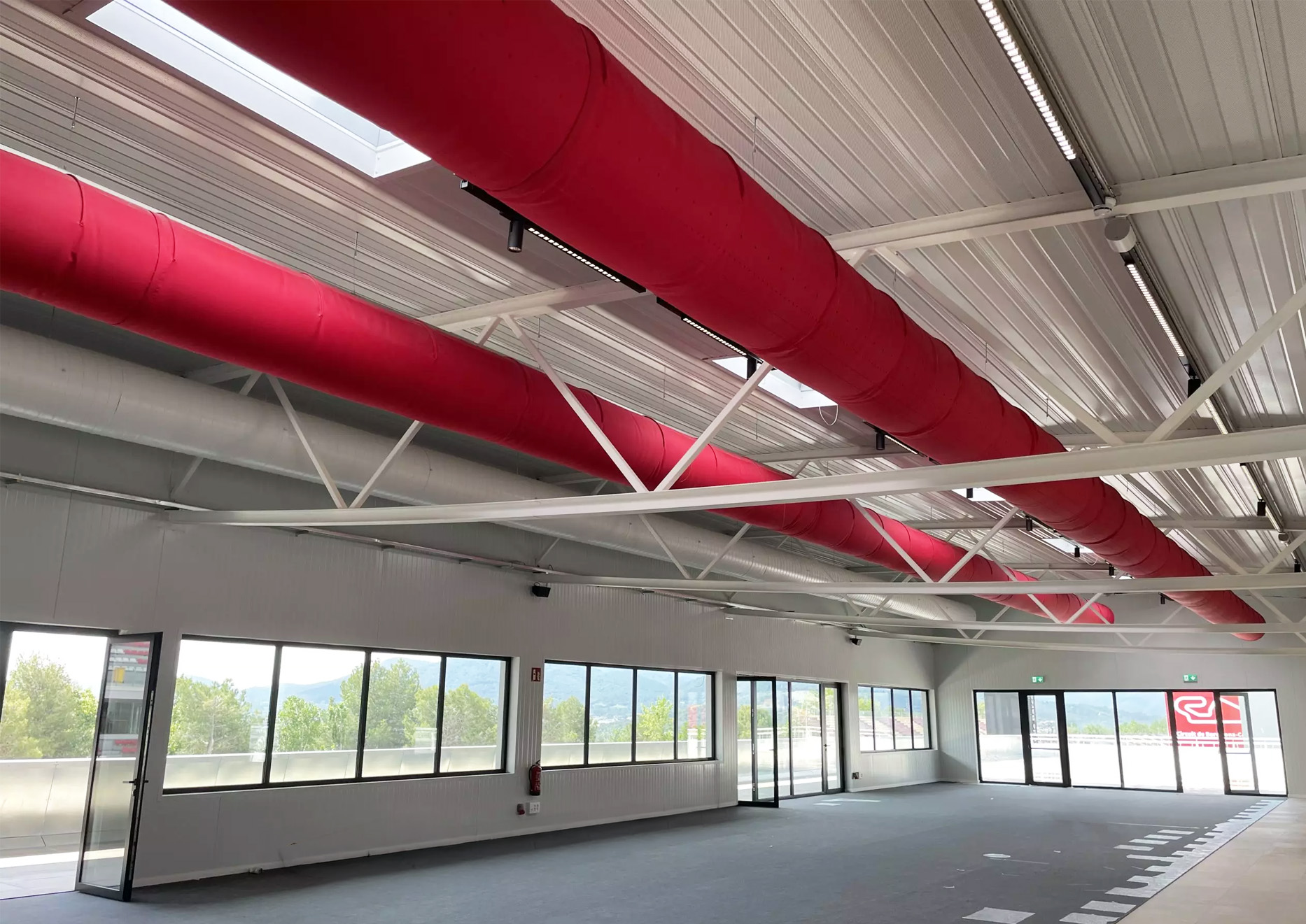 A fabric ducting system can be seen installed in plain sight and a custom red color