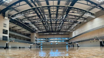 Sleek black fabric duct system improves indoor air quality in the National Sport Centre of Latvia