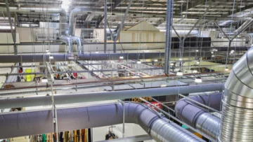 Gray fabric ducting installed in the open ceiling of the Spencer Outlet Centre in Melbourne, Australia