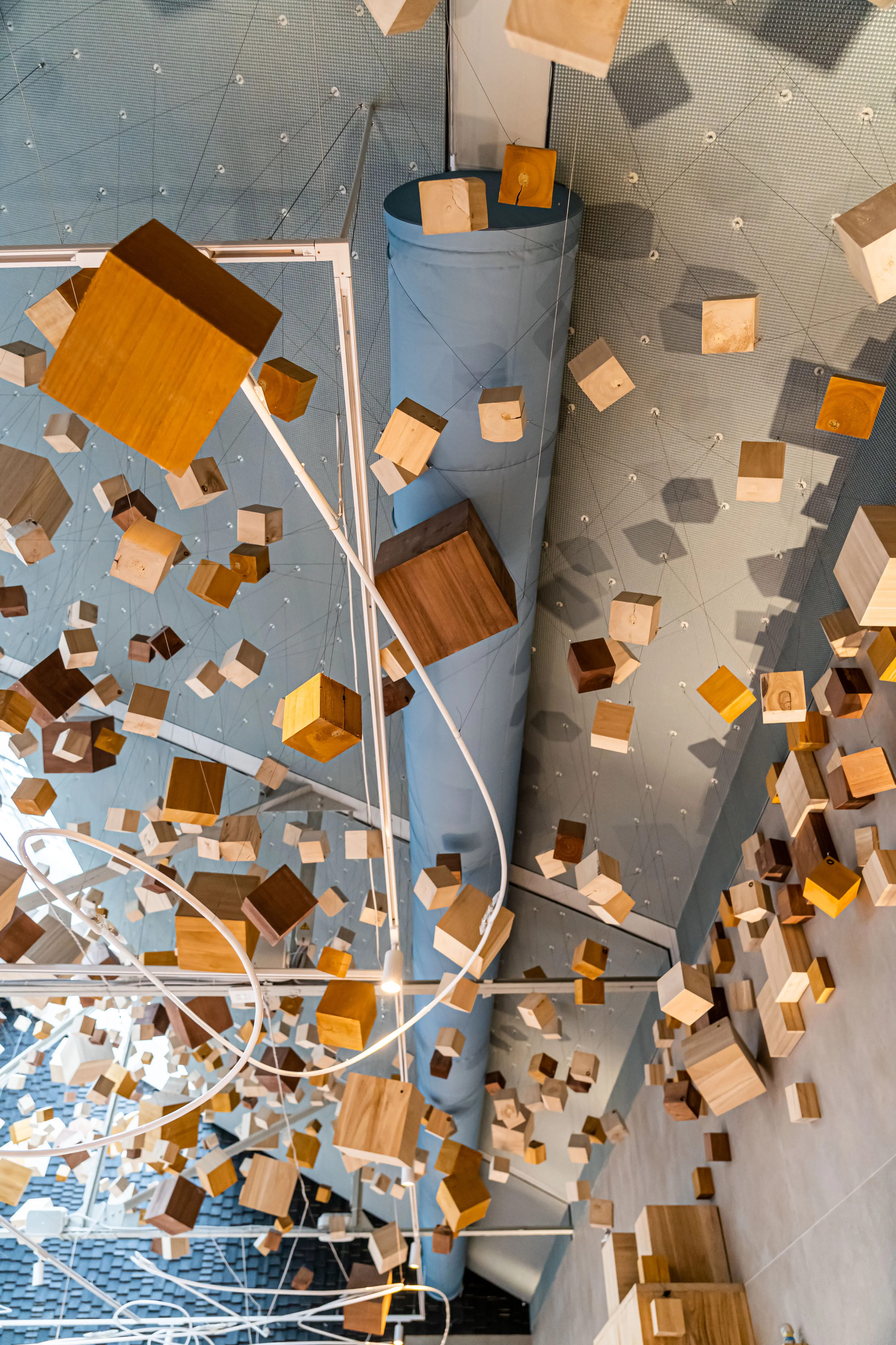 Gray fabric ducts installed in the dining room of Omeraki, a Michelin starred restaurant in Madrid.