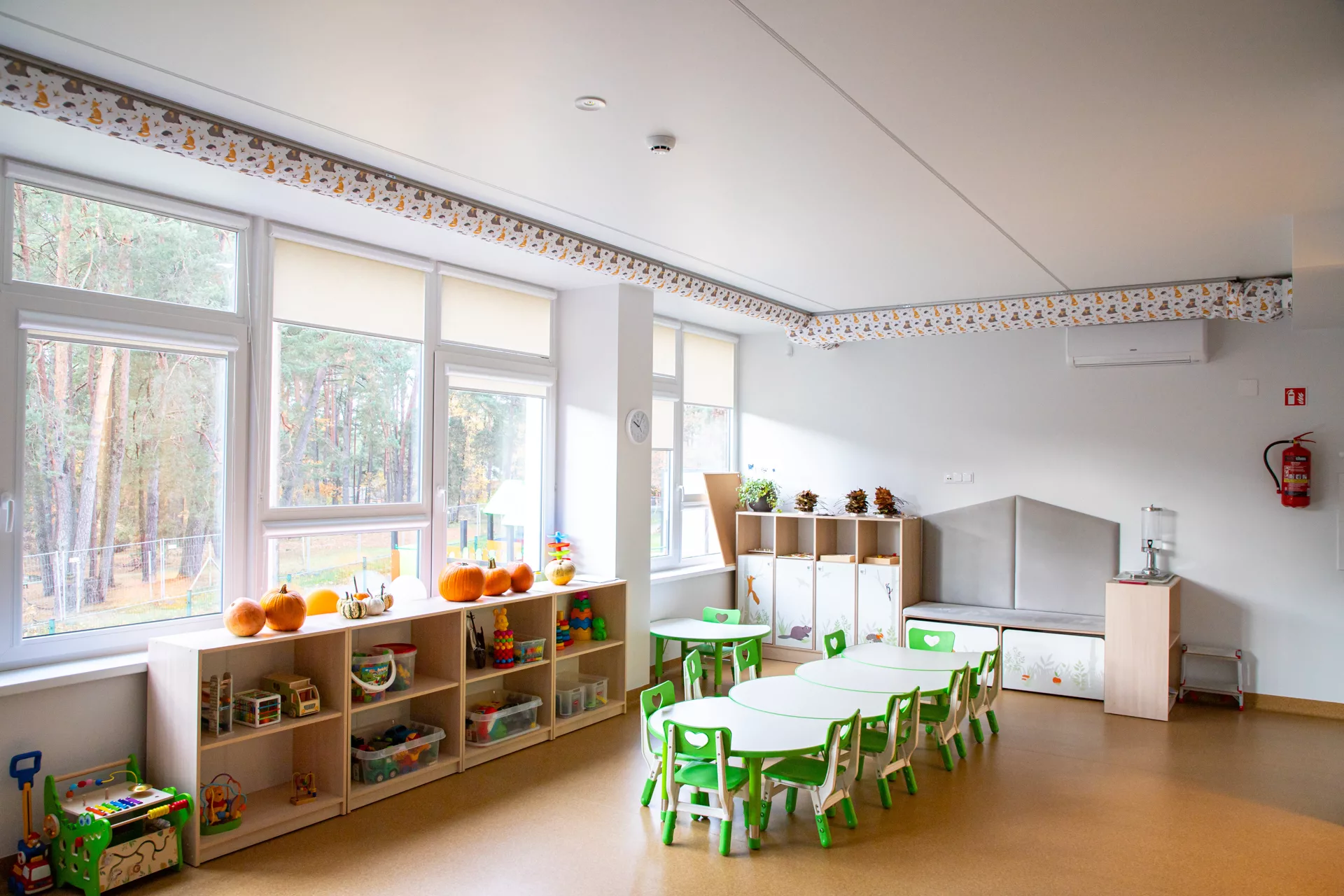 FabricAir ducts with a D-shaped profile and a whimsical woodland animal print are installed in a kindergarten classroom in Kulautuva, Lithuania.