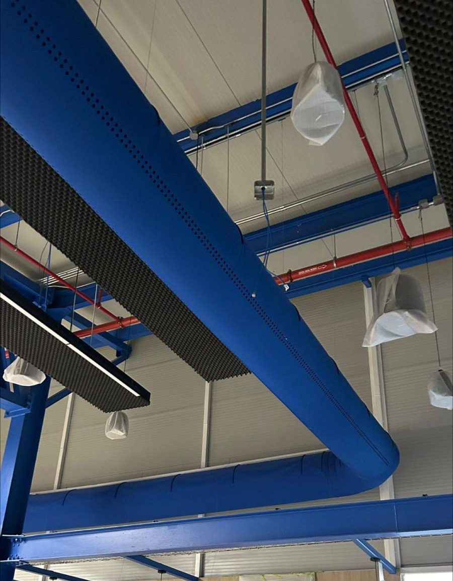 Blue FabricAir textile ducts provide comfortable, efficient airflow in auditoriums and offices.