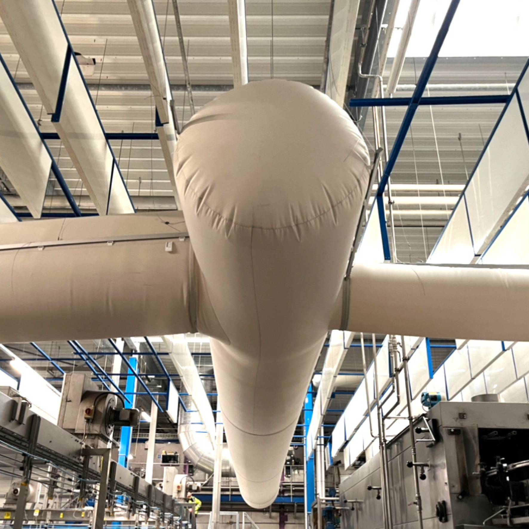 Custom-engineered fabric air dispersion systems installed in an mineral water bottling facility established in 1247