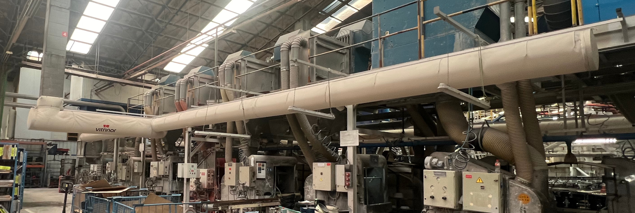 Custom printed fabric air dispersion systems ensure precise air delivery to occupied spaces in the Vitrinor factory in Spain