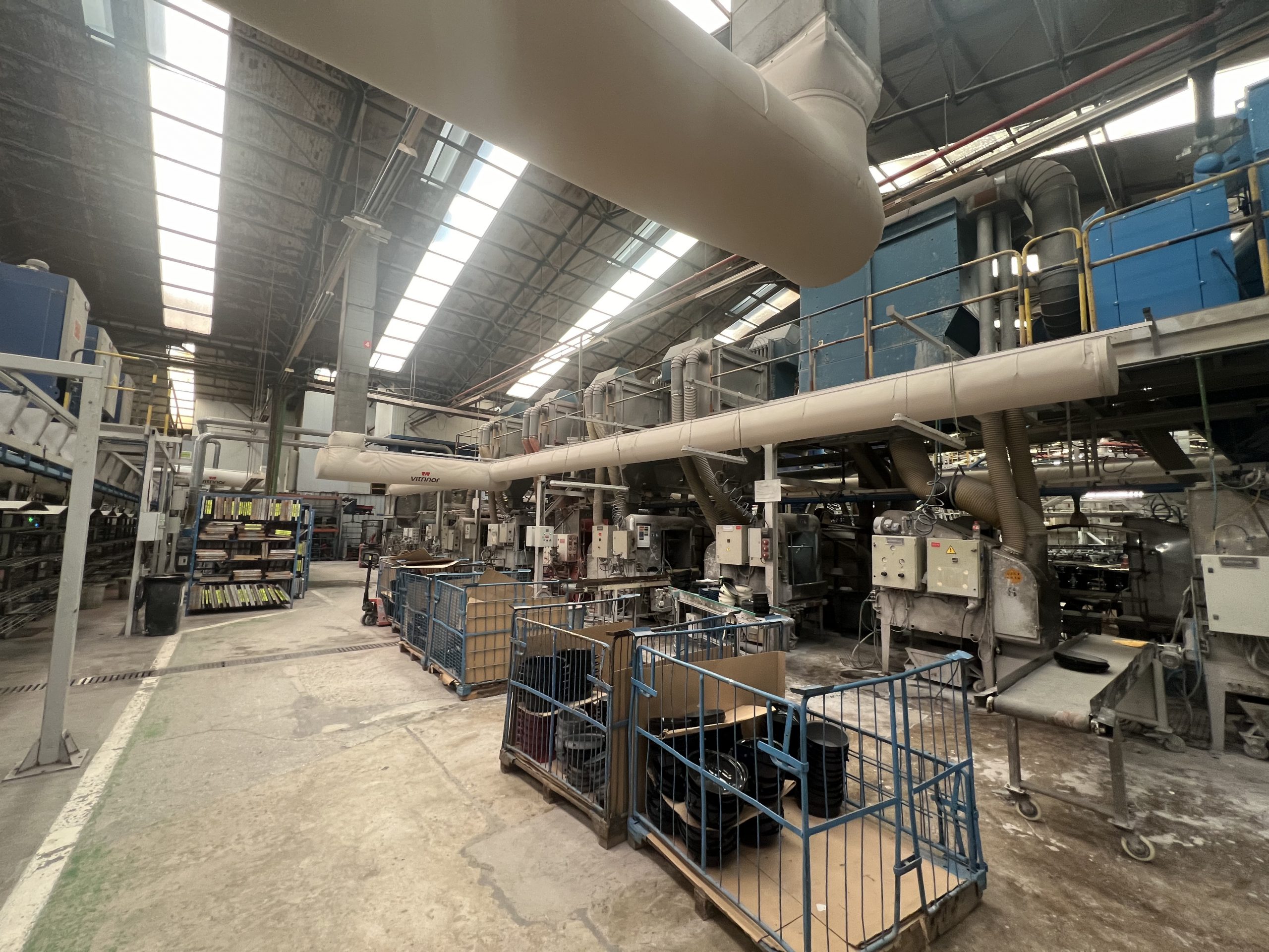 Custom printed fabric air dispersion systems ensure precise air delivery to occupied spaces in the Vitrinor factory in Spain