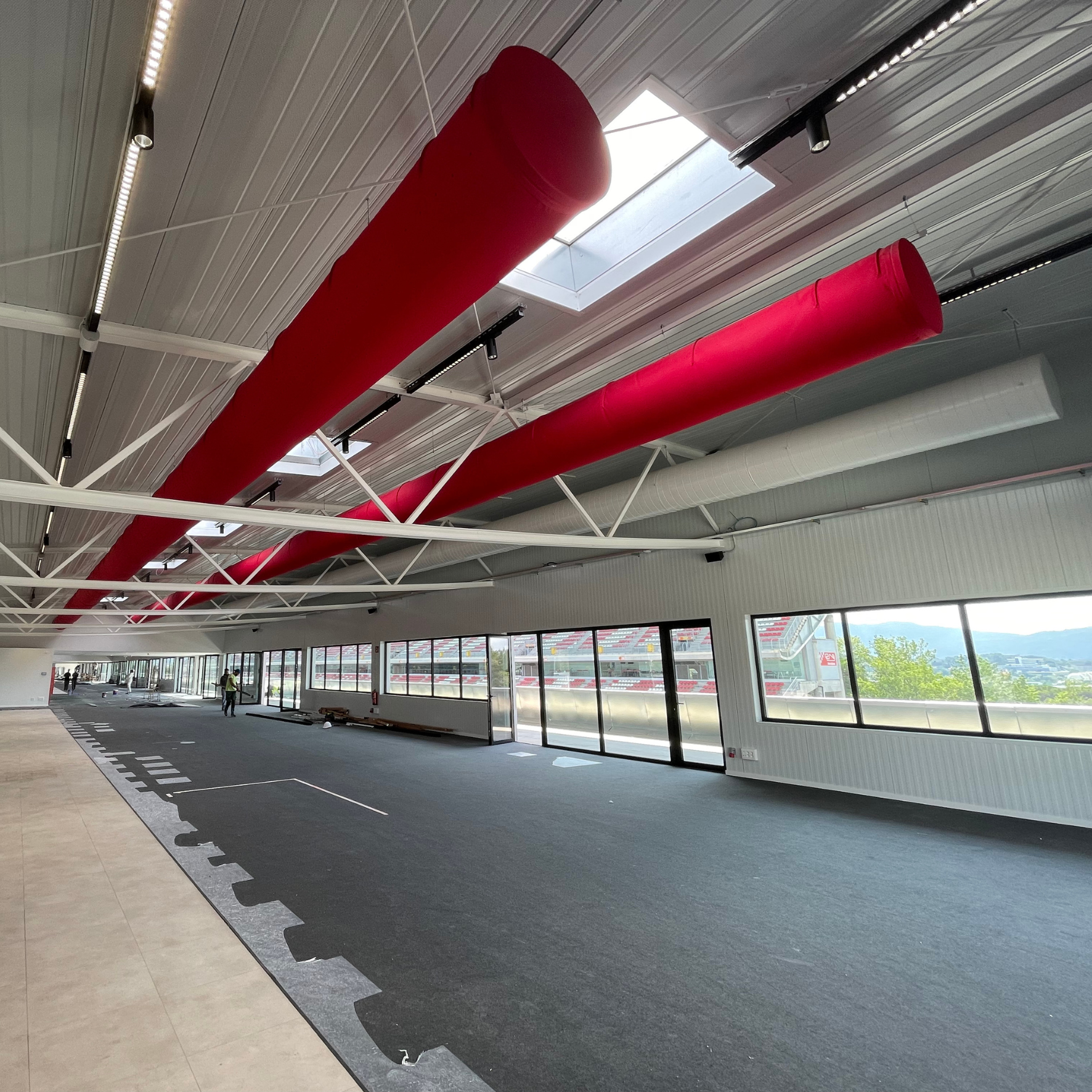 Red fabric ducts provide ideal climate in a new event space at the Circuito de Barcelona- Cataluna