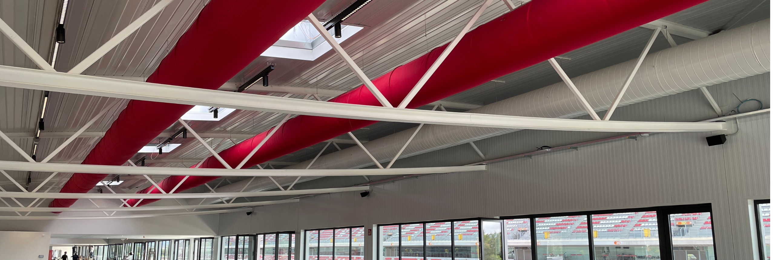 Red fabric ducts provide ideal climate in a new event space at the Circuito de Barcelona- Cataluna