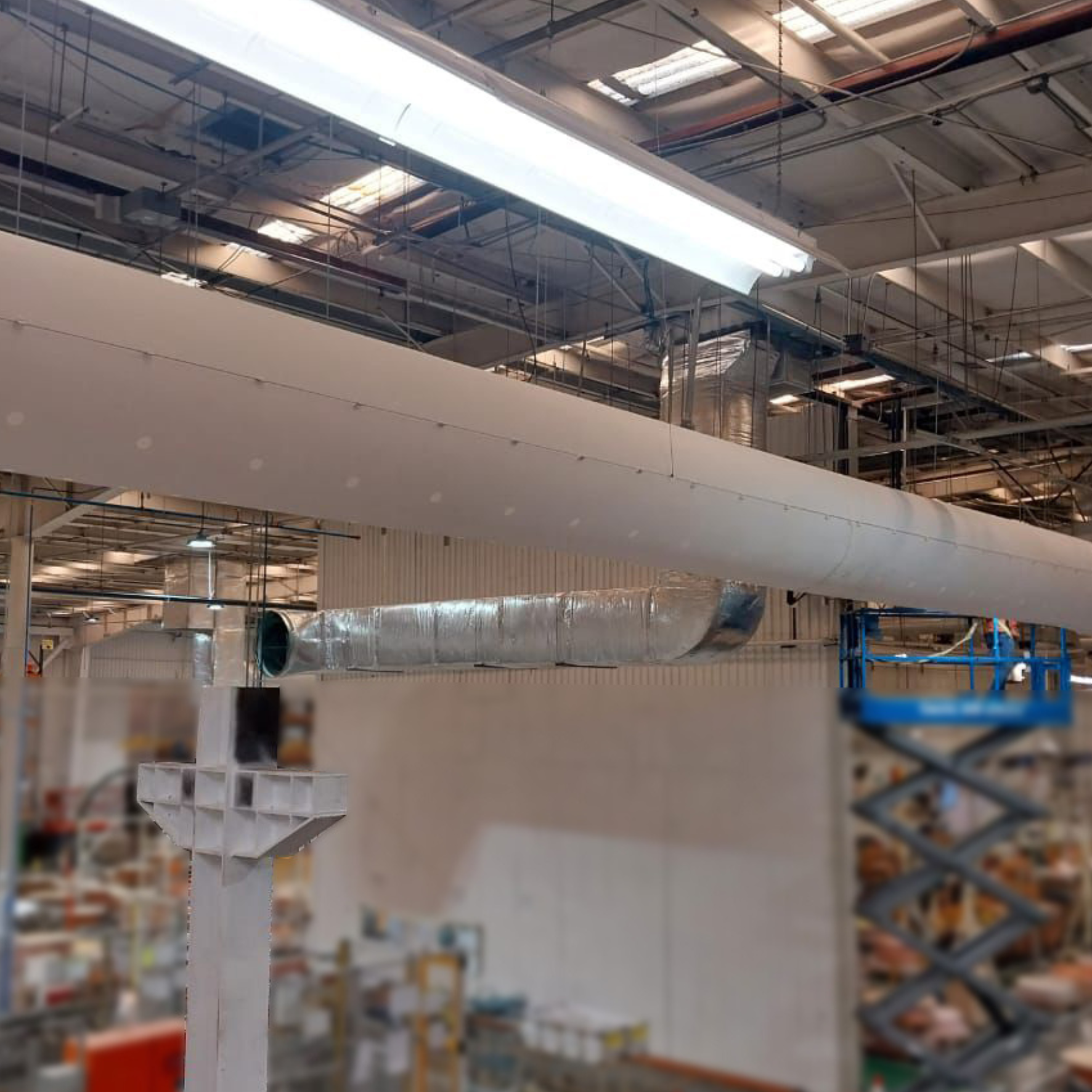 White fabric ducts provide precision airflow for the Mitsubishi automotive plant in Mexico.