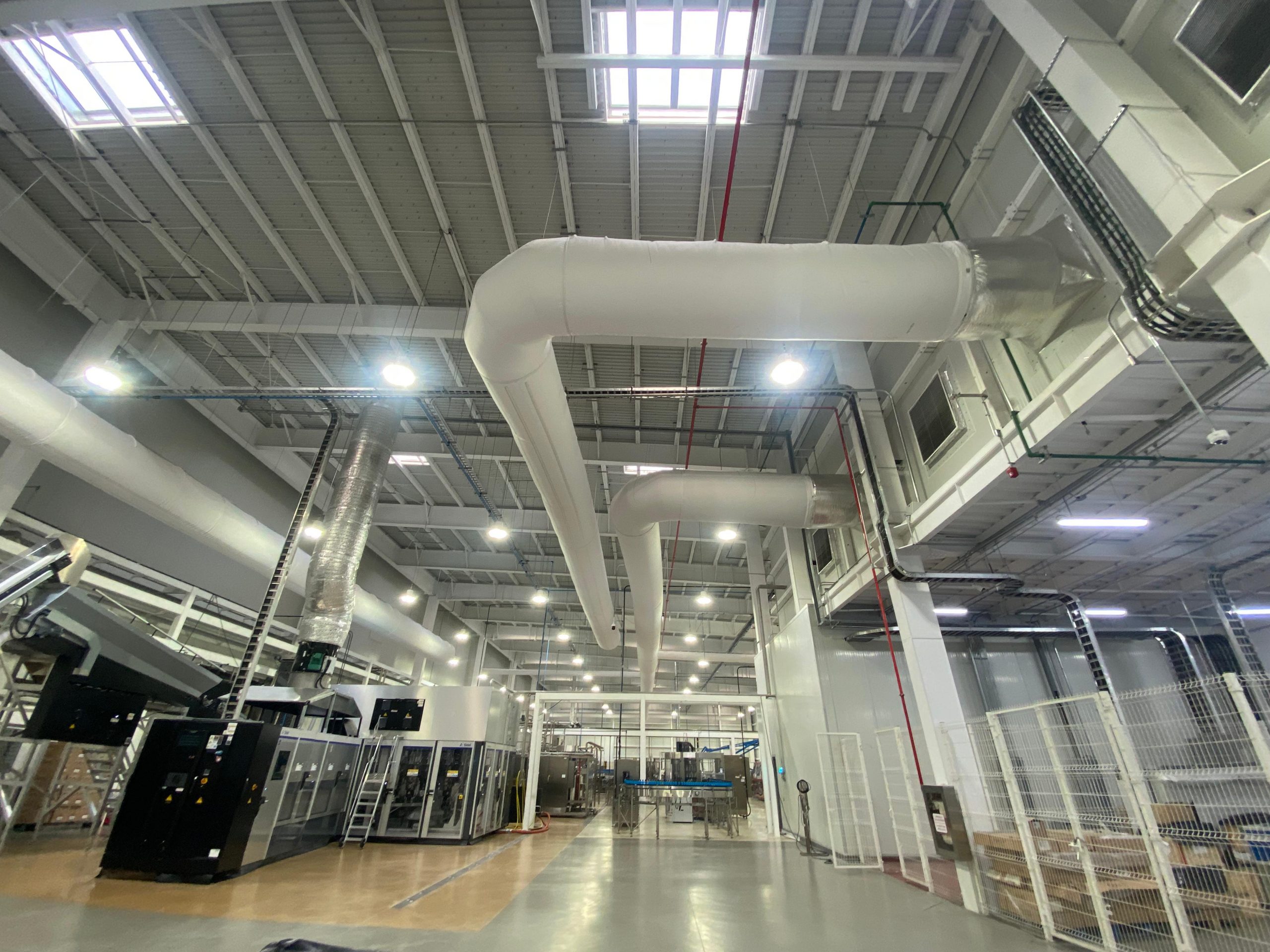 White fabric ducts elevate the indoor air quality inside the JUMEX juice plant in Monterrey, Mexico