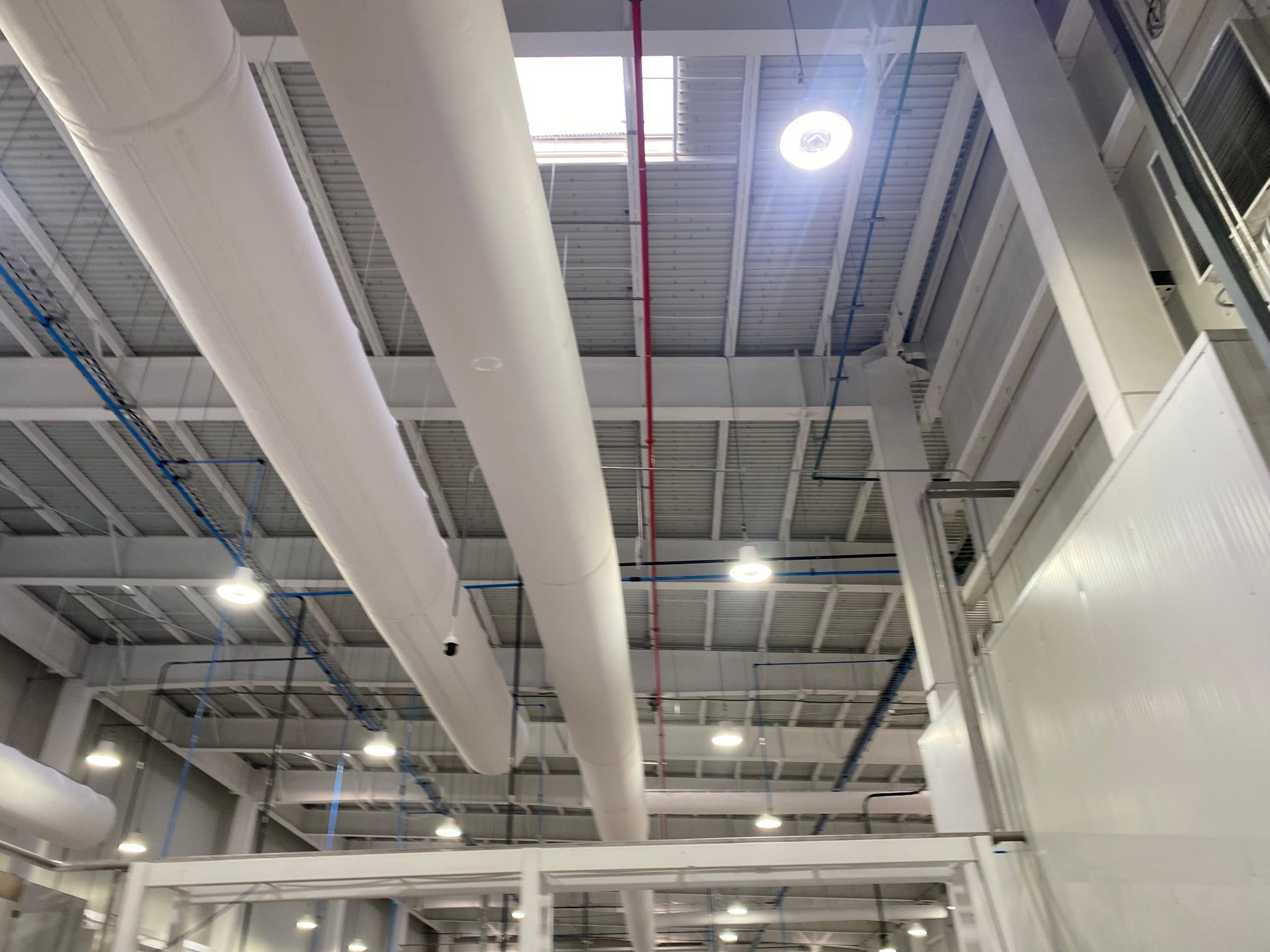 White fabric ducts elevate the indoor air quality inside the JUMEX juice plant in Monterrey, Mexico