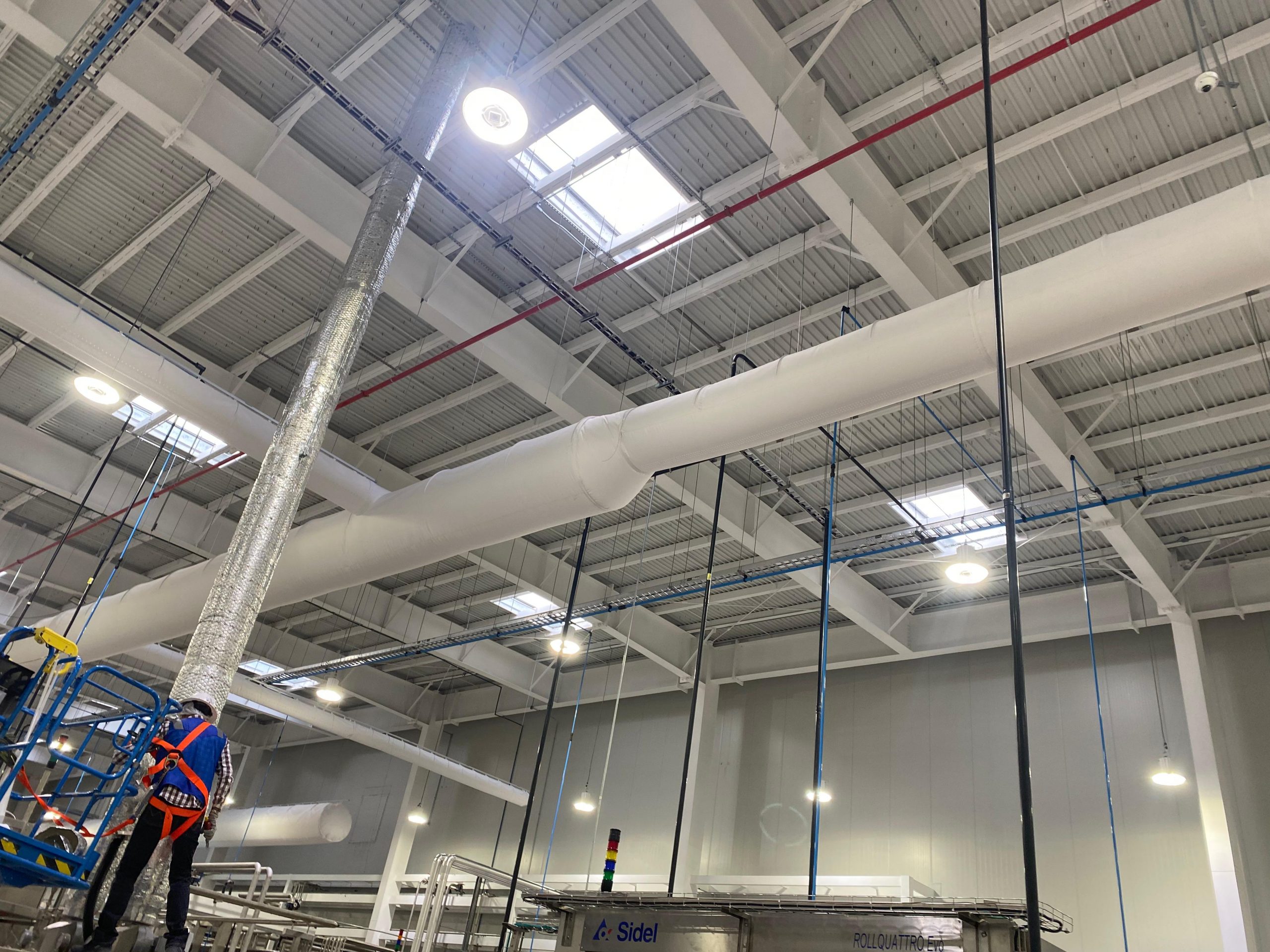 White fabric ducts elevate the indoor air quality inside the JUMEX juice plant in Monterrey, Mexico