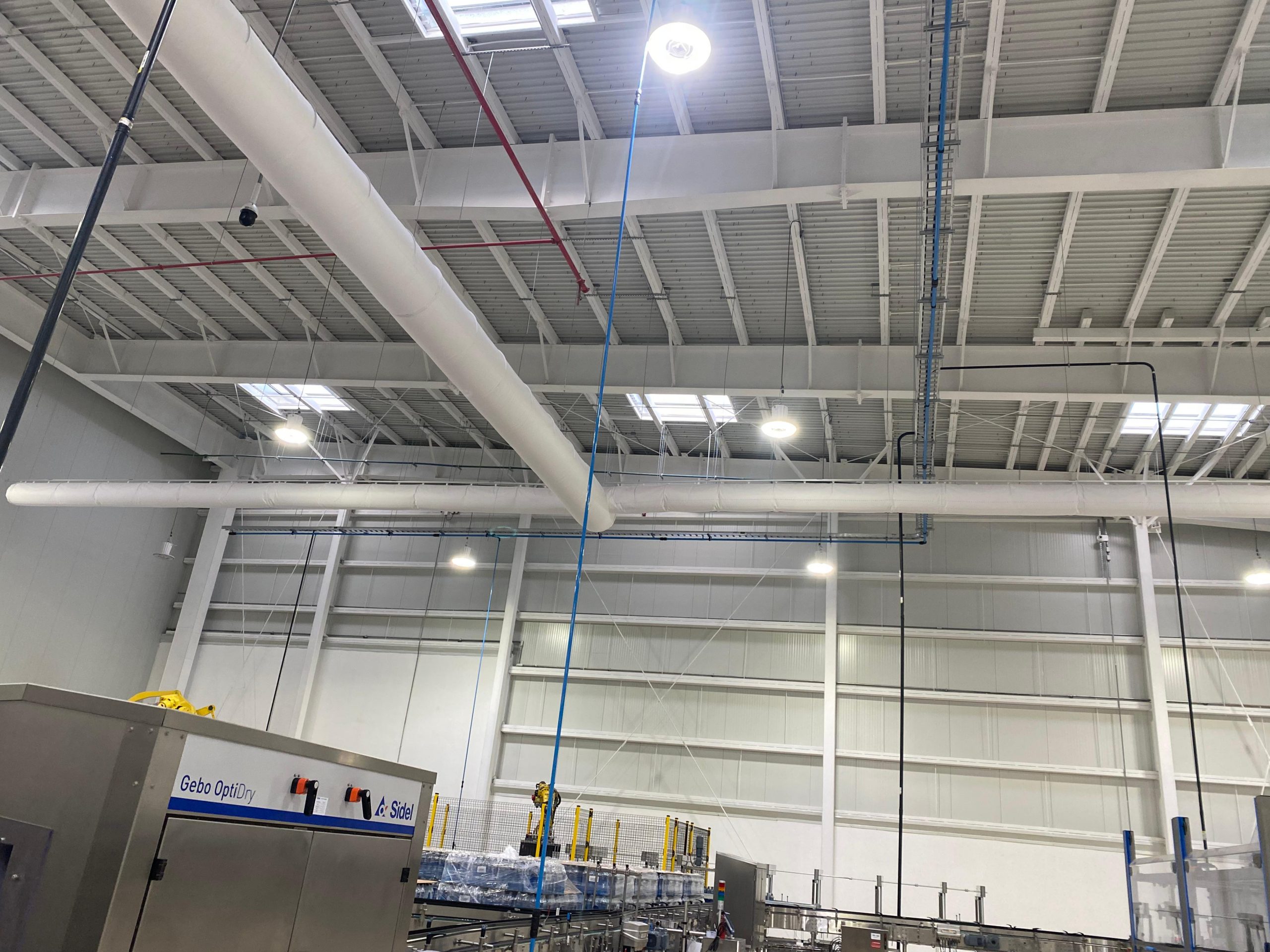 White fabric ducts elevate the indoor air quality inside the JUMEX juice plant in Monterrey, Mexico