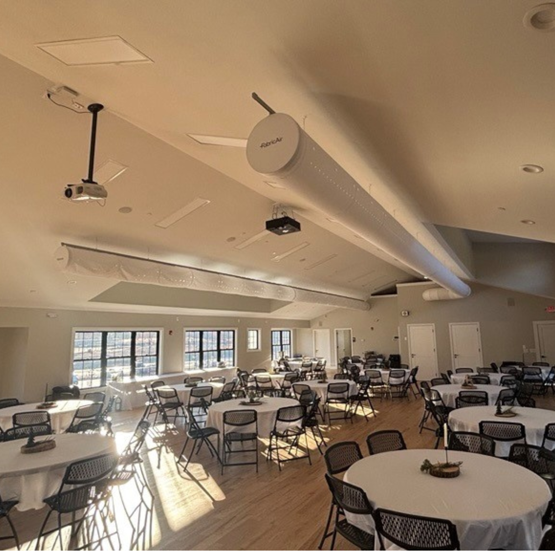 White fabric ducting replaces metal ductwork in elegant event space