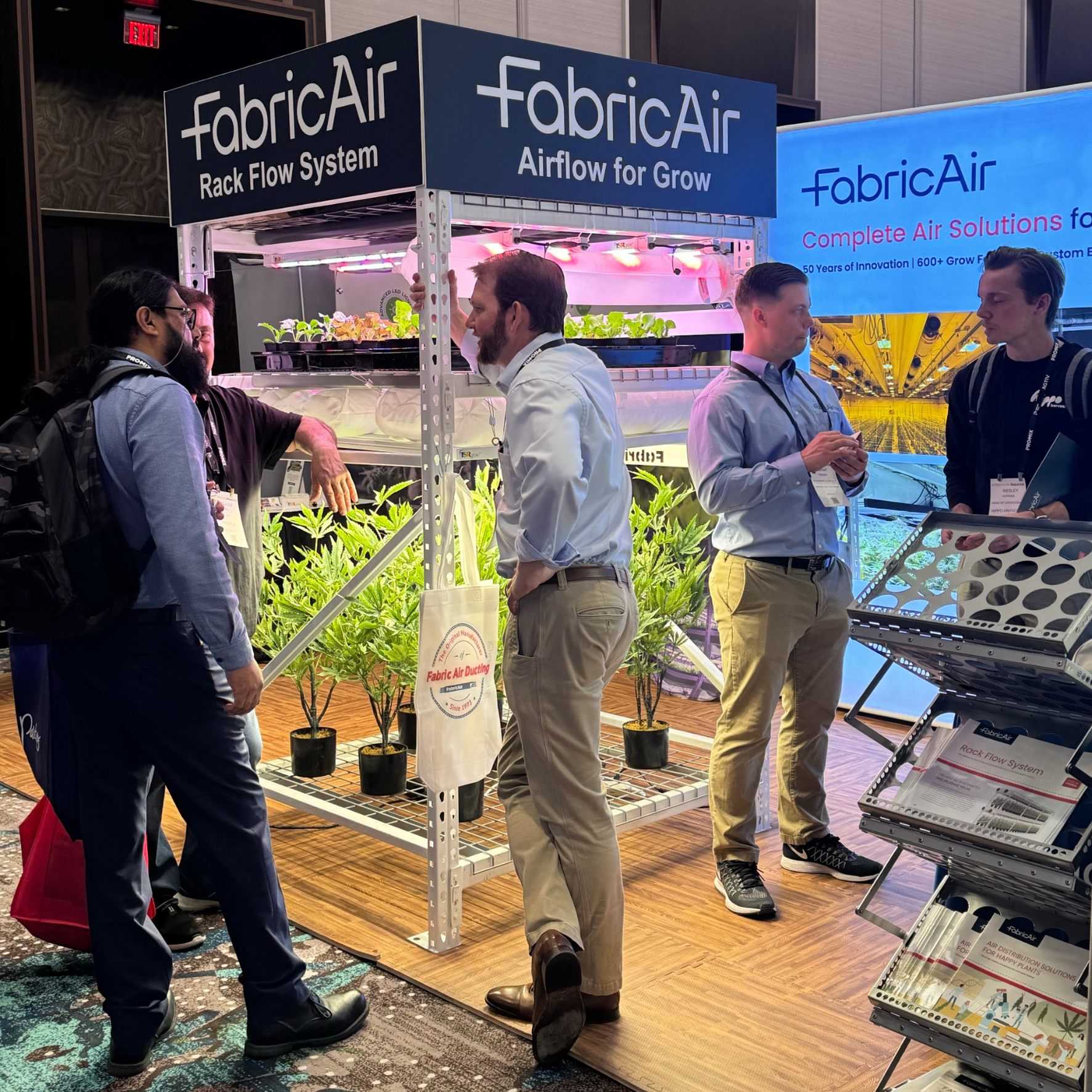 FabricAir grow experts talk to Indoor Ag-Con visitors in the booth