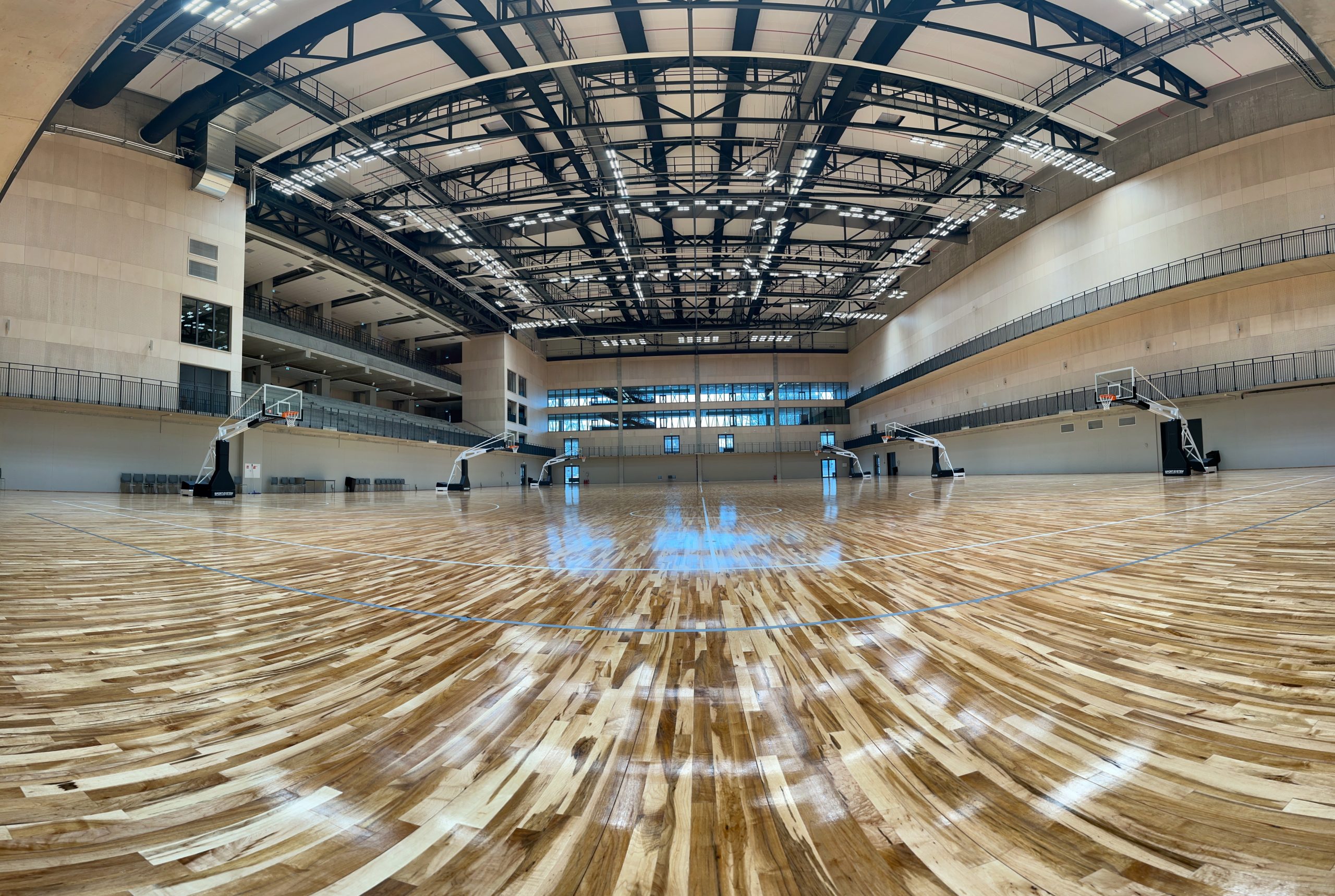 Sleek black fabric duct system improves indoor air quality in the National Sport Centre of Latvia