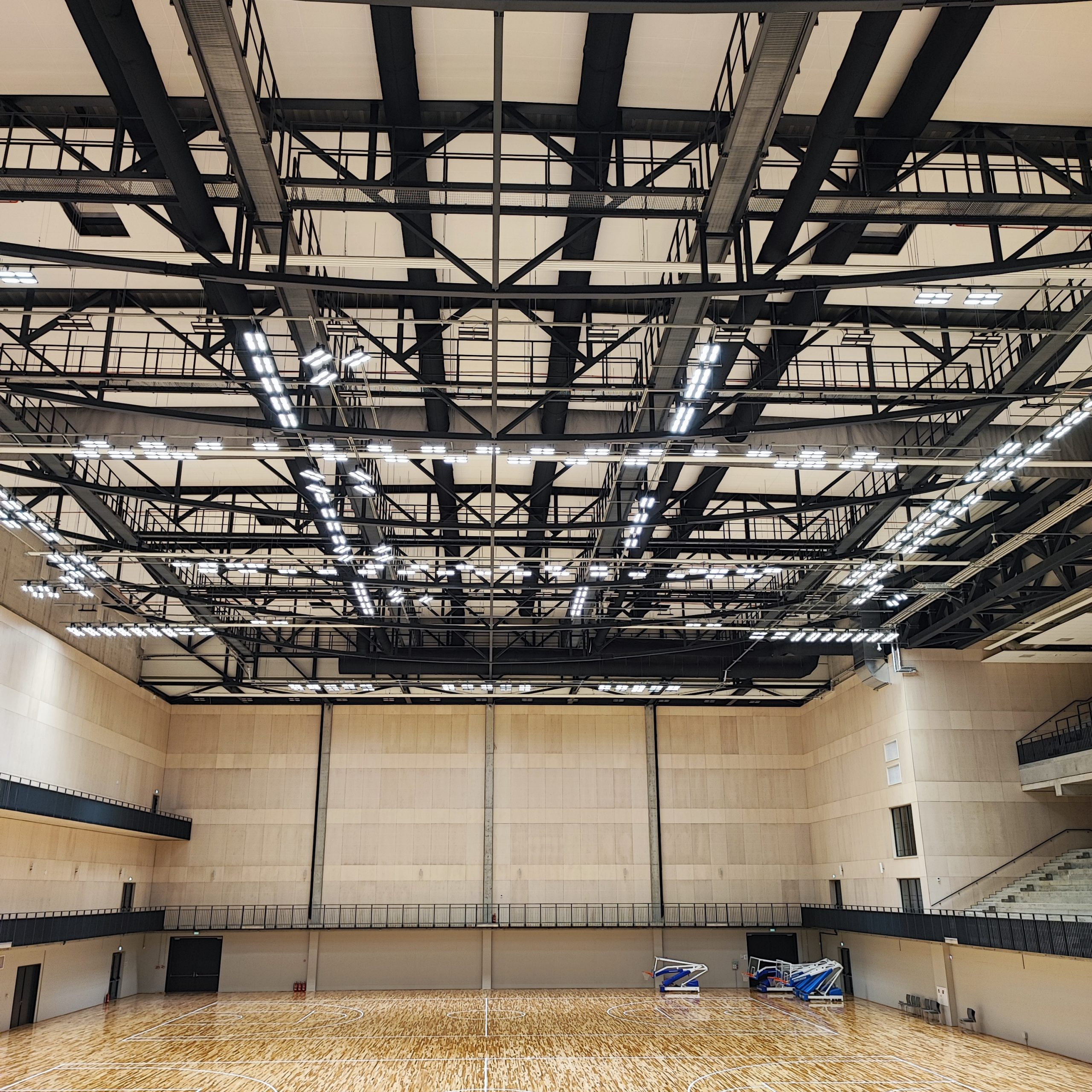 Sleek black fabric duct system improves indoor air quality in the National Sport Centre of Latvia