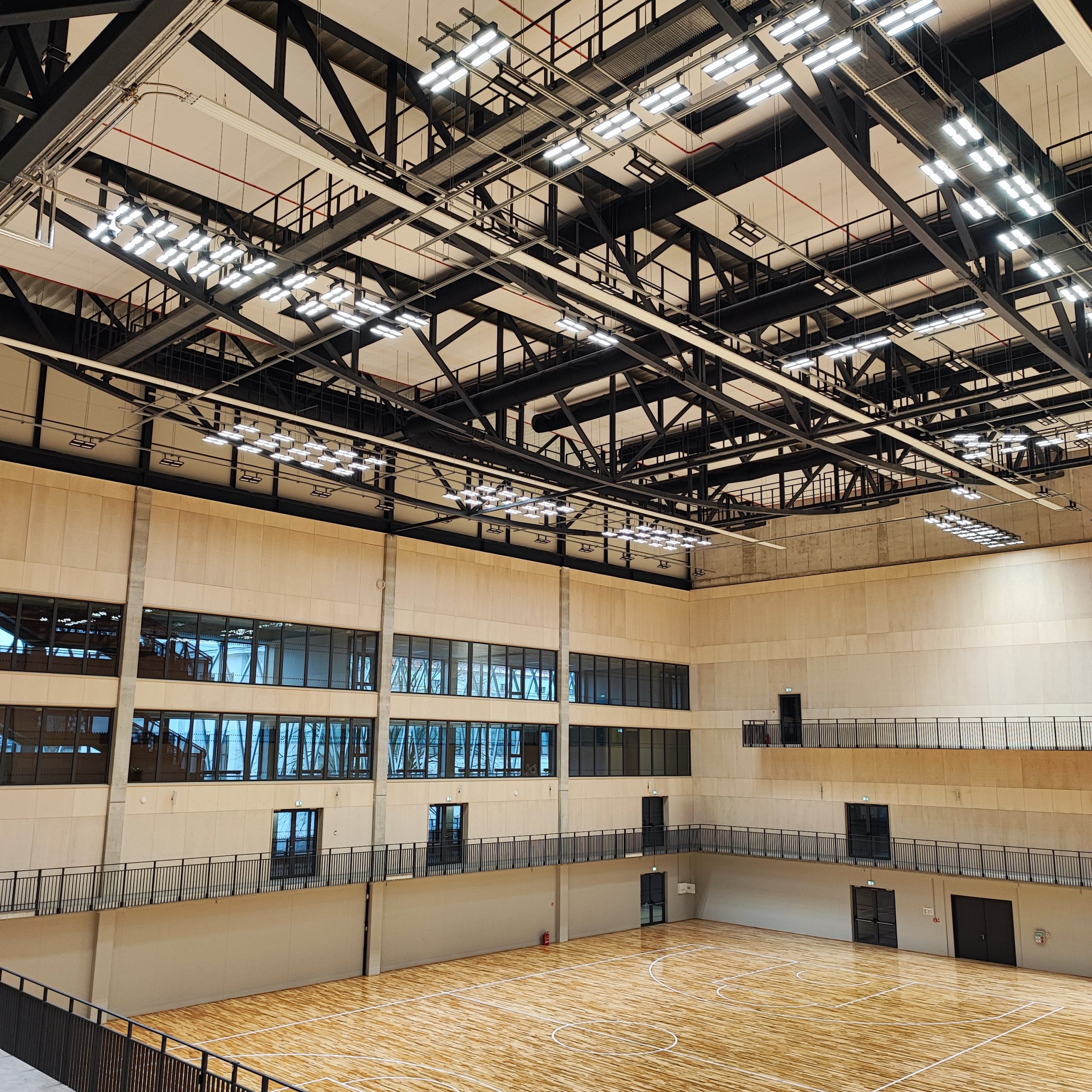Sleek black fabric duct system improves indoor air quality in the National Sport Centre of Latvia