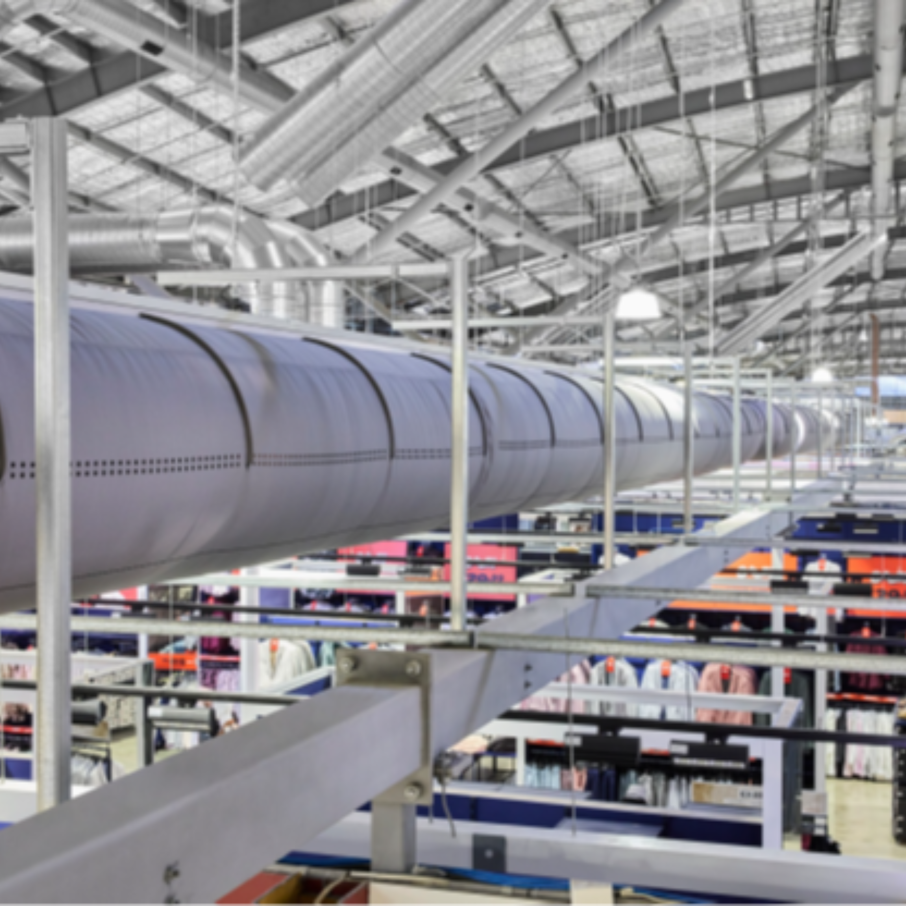 Gray fabric ducting installed in the open ceiling of the Spencer Outlet Centre in Melbourne, Australia