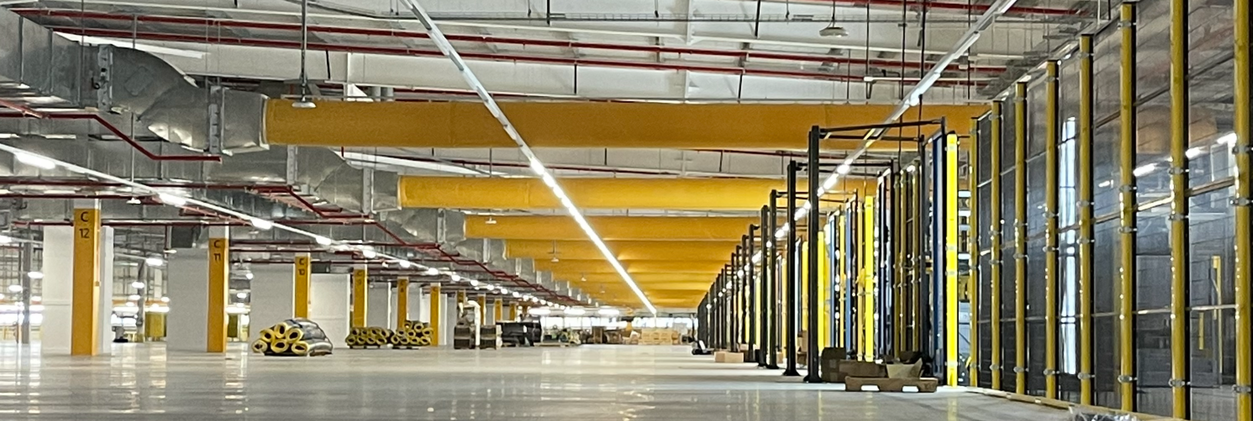 Orange fabric ducts installed in a global distribution center in Australia
