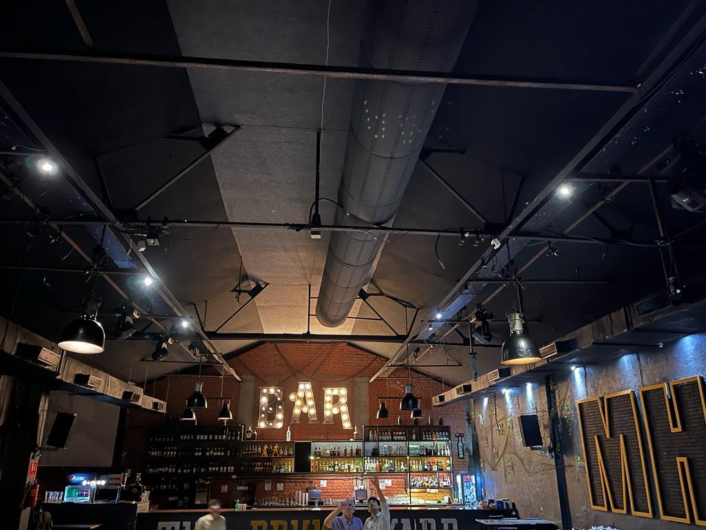 Black fabric ducting provides comfort and enhances the design of a Resto-bar in Thane, India