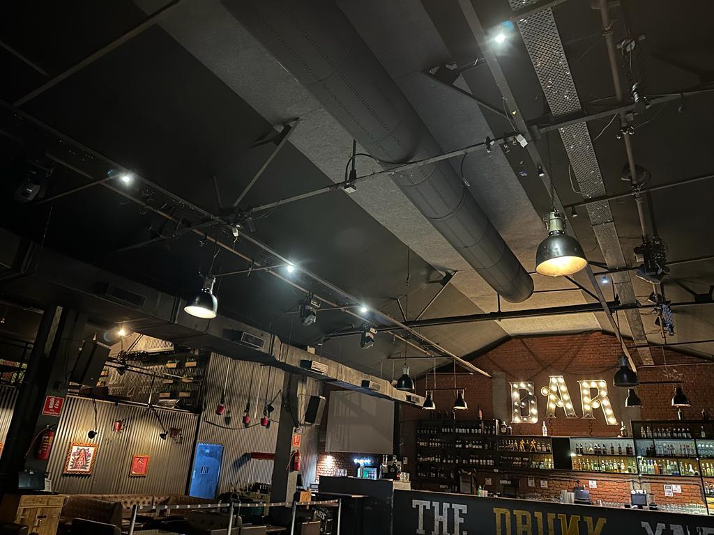 Black fabric ducting provides comfort and enhances the design of a Resto-bar in Thane, India