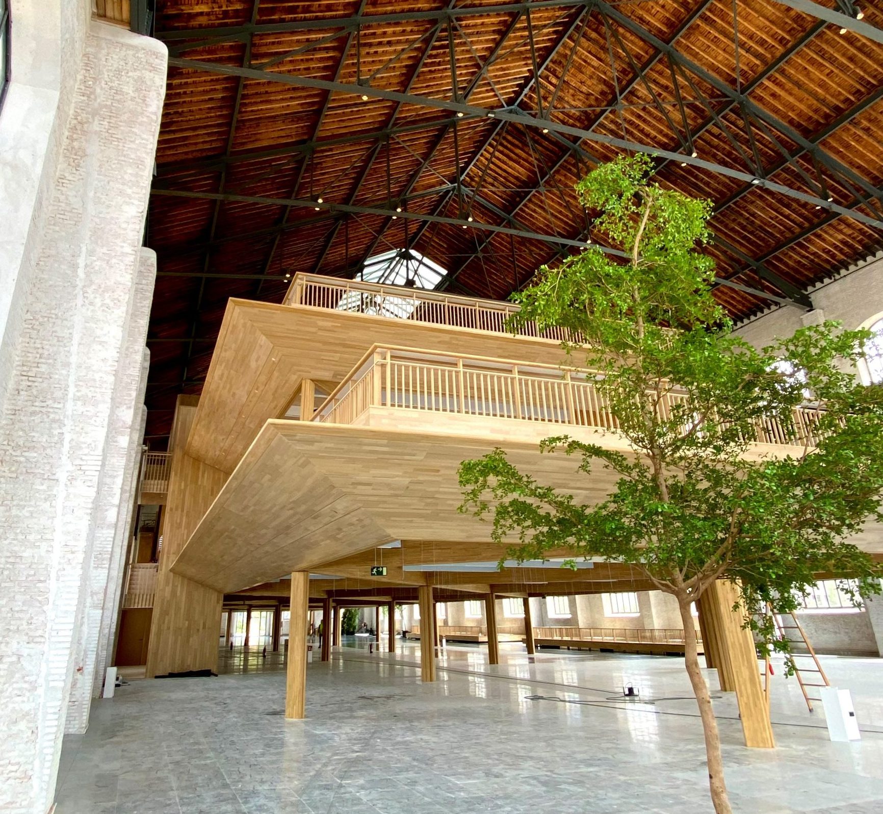 A temporary structure insde of a bigger building with an ecological look where FabricAir installed an HVAC system with fabric ducts