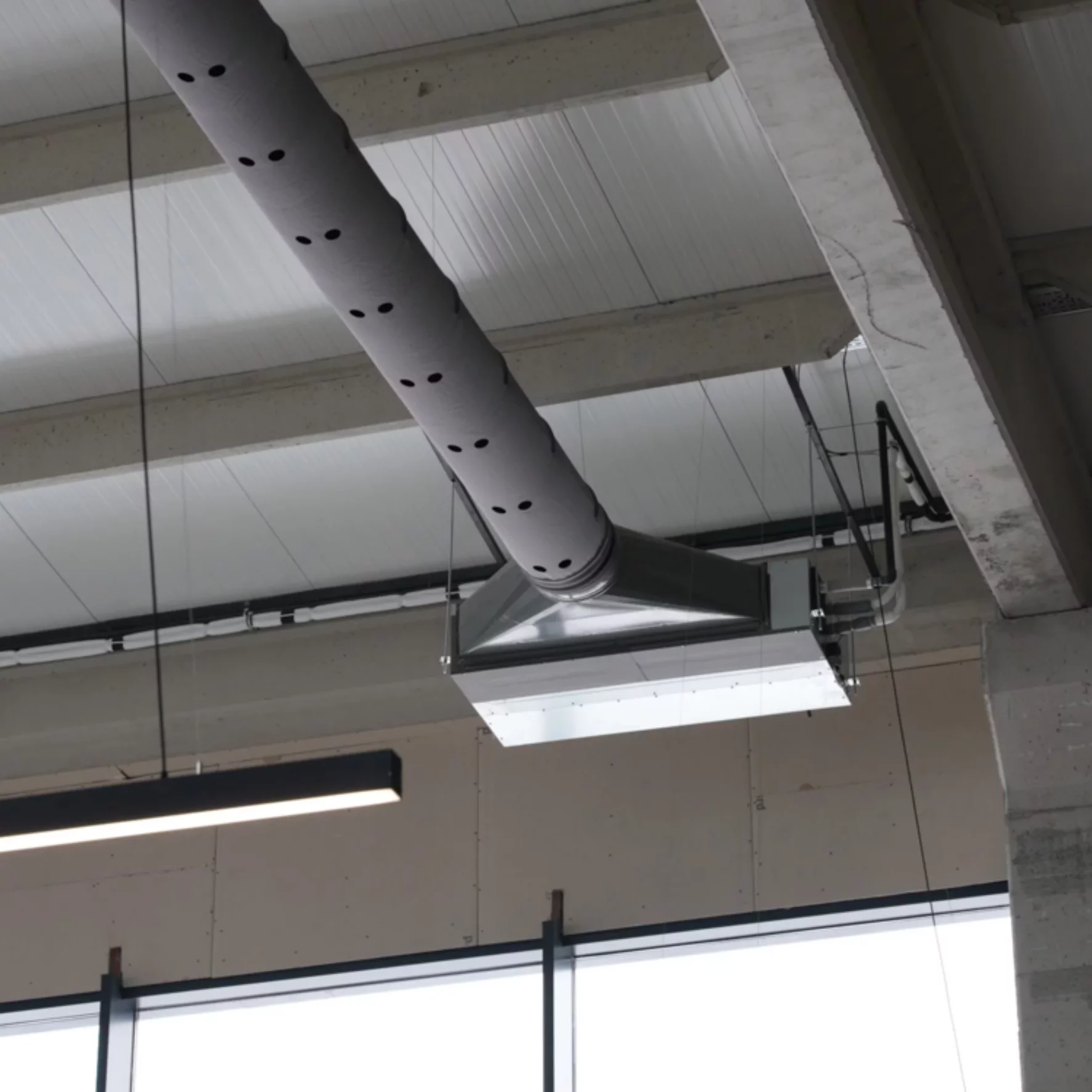 Fabric Duct System Delivers Optimal Comfort for High-Ceiling Showroom ...