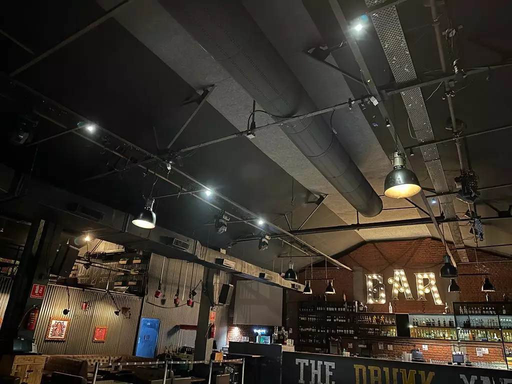 Black fabric ducting provides comfort and enhances the design of a Resto-bar in Thane, India